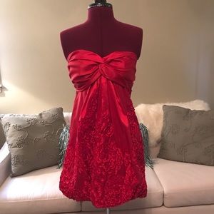 Red cocktail dress by Josh & Jazz.
